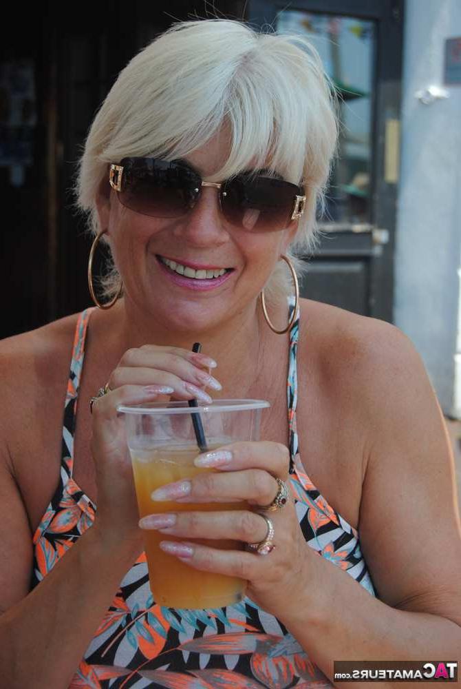 20P Busty hot mature Dimonty shows off her great legs & big tits in public