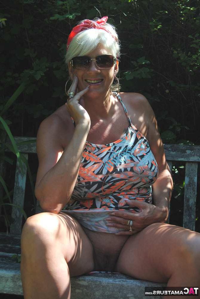20P Busty hot mature Dimonty shows off her great legs & big tits in public