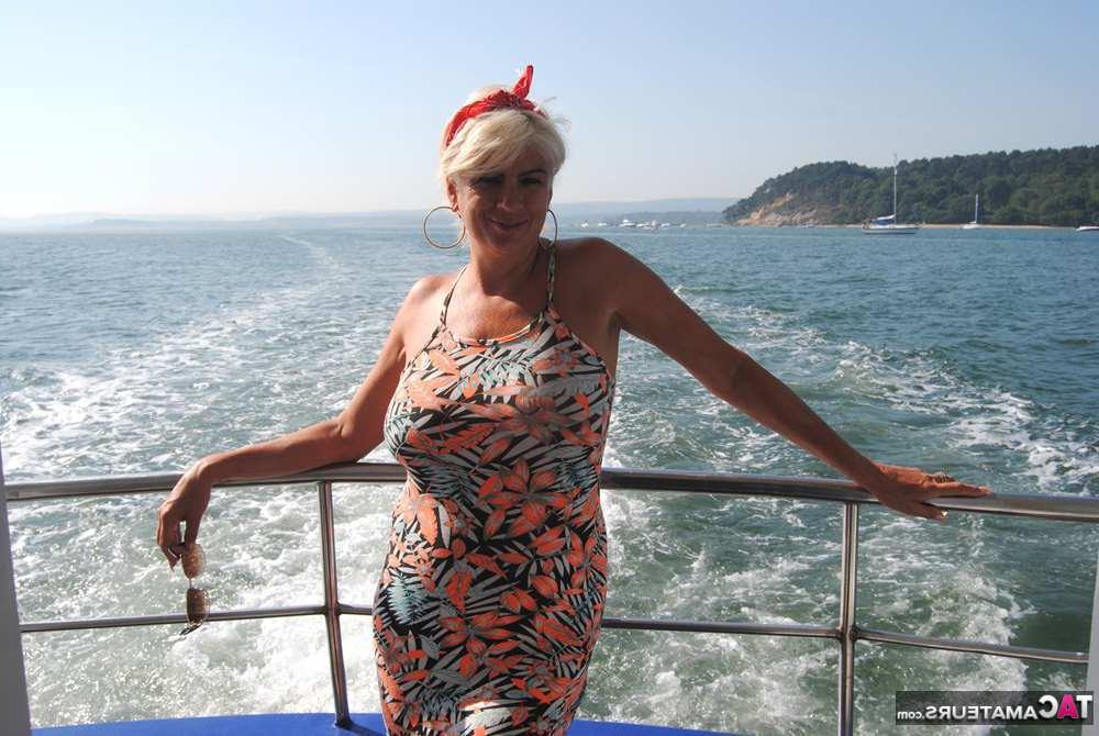 20P Busty hot mature Dimonty shows off her great legs & big tits in public