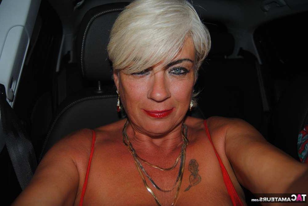 20P Busty hot mature Dimonty shows off her great legs & big tits in public