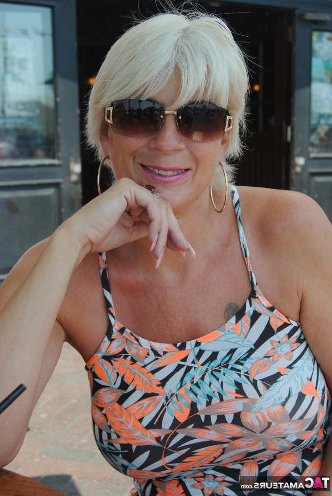 20P Busty hot mature Dimonty shows off her great legs & big tits in public