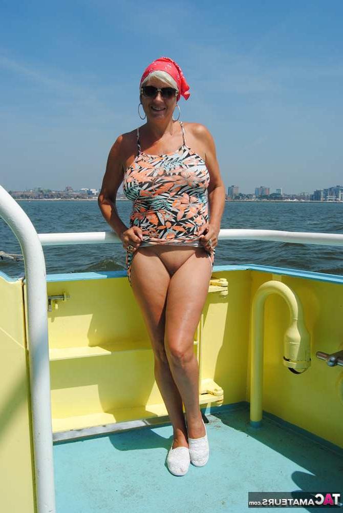 20P Busty hot mature Dimonty shows off her great legs & big tits in public