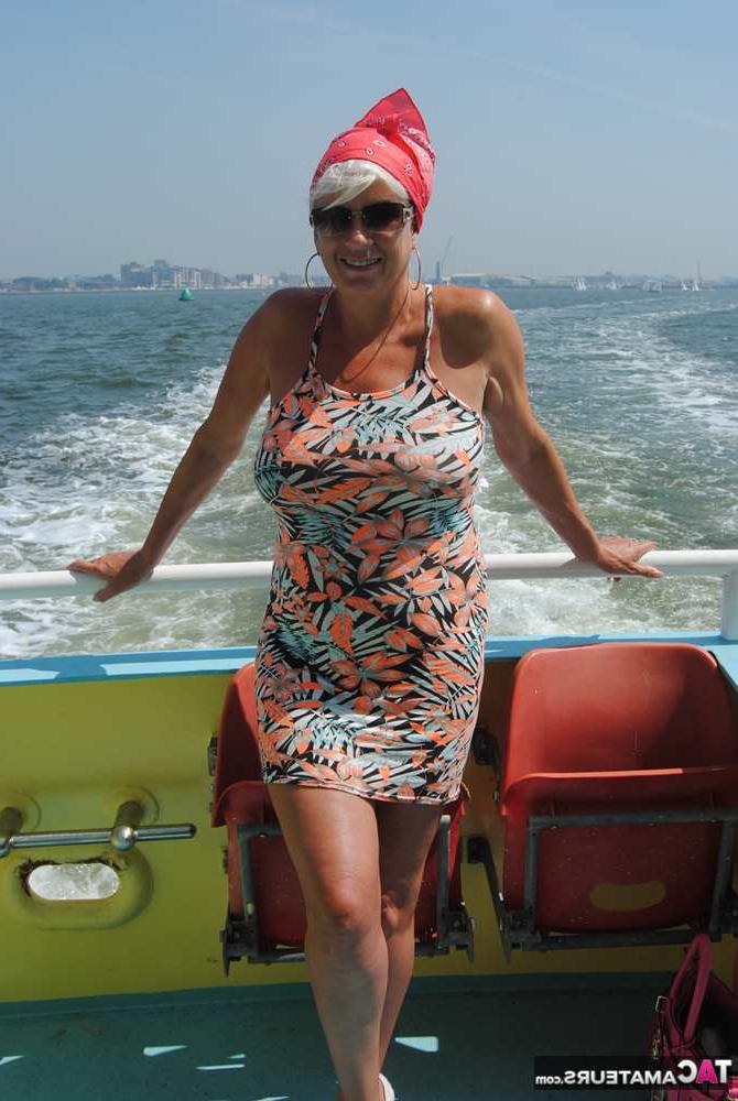20P Busty hot mature Dimonty shows off her great legs & big tits in public
