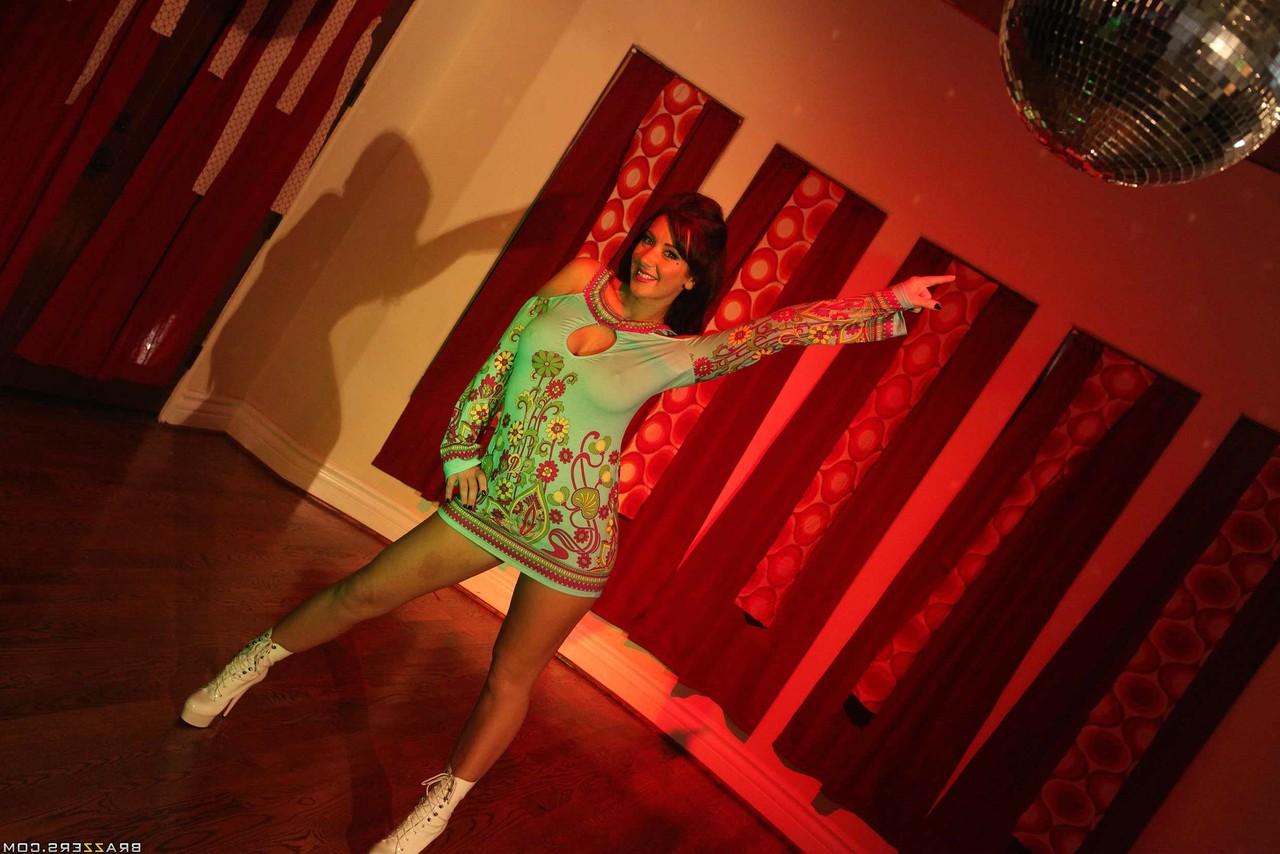 17P Lovely brunette MILF with big tits Jayden Jaymes has fun at 70's party