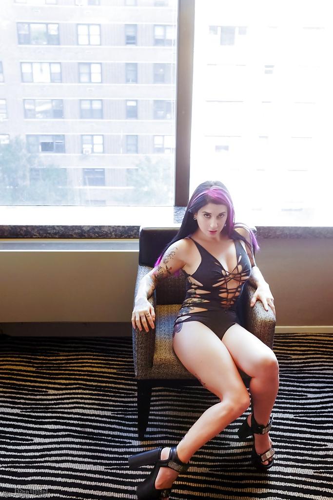 12P Tattoo model Joanna Angel posing in high heels and exposing puffy pussy