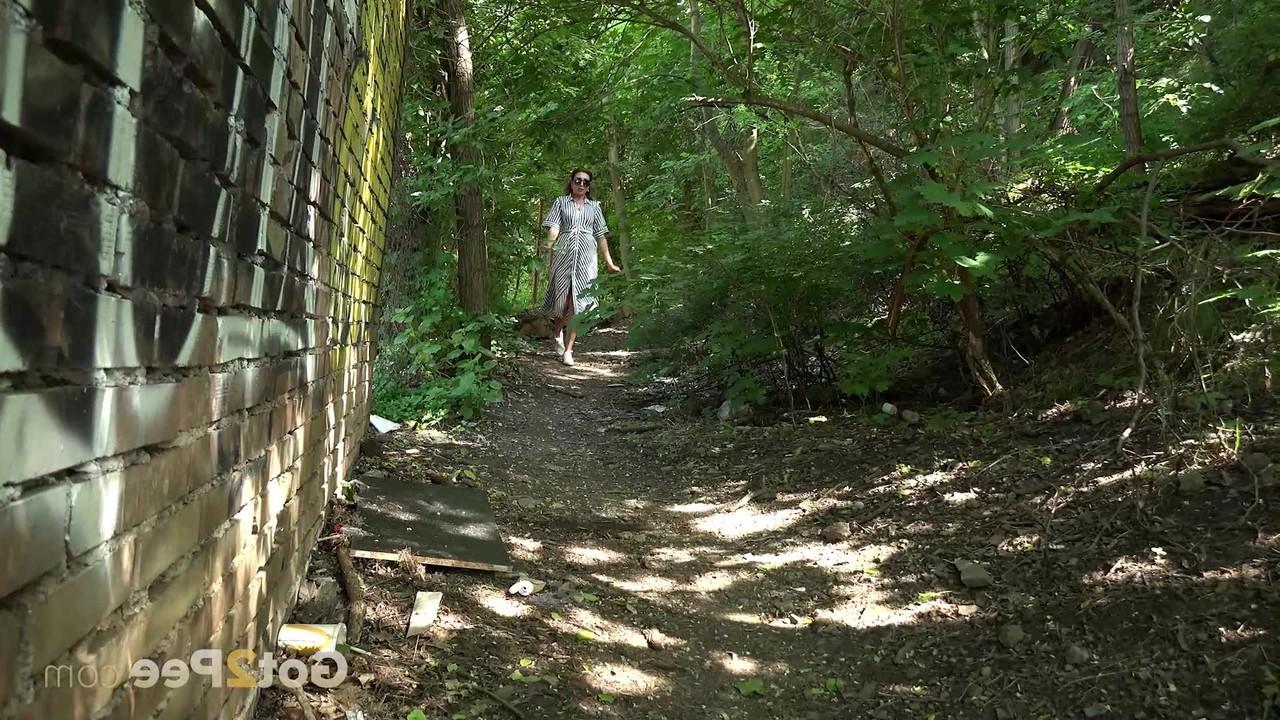 15P Caucasian chick Julia North gets caught taking a piss on a path in the woods