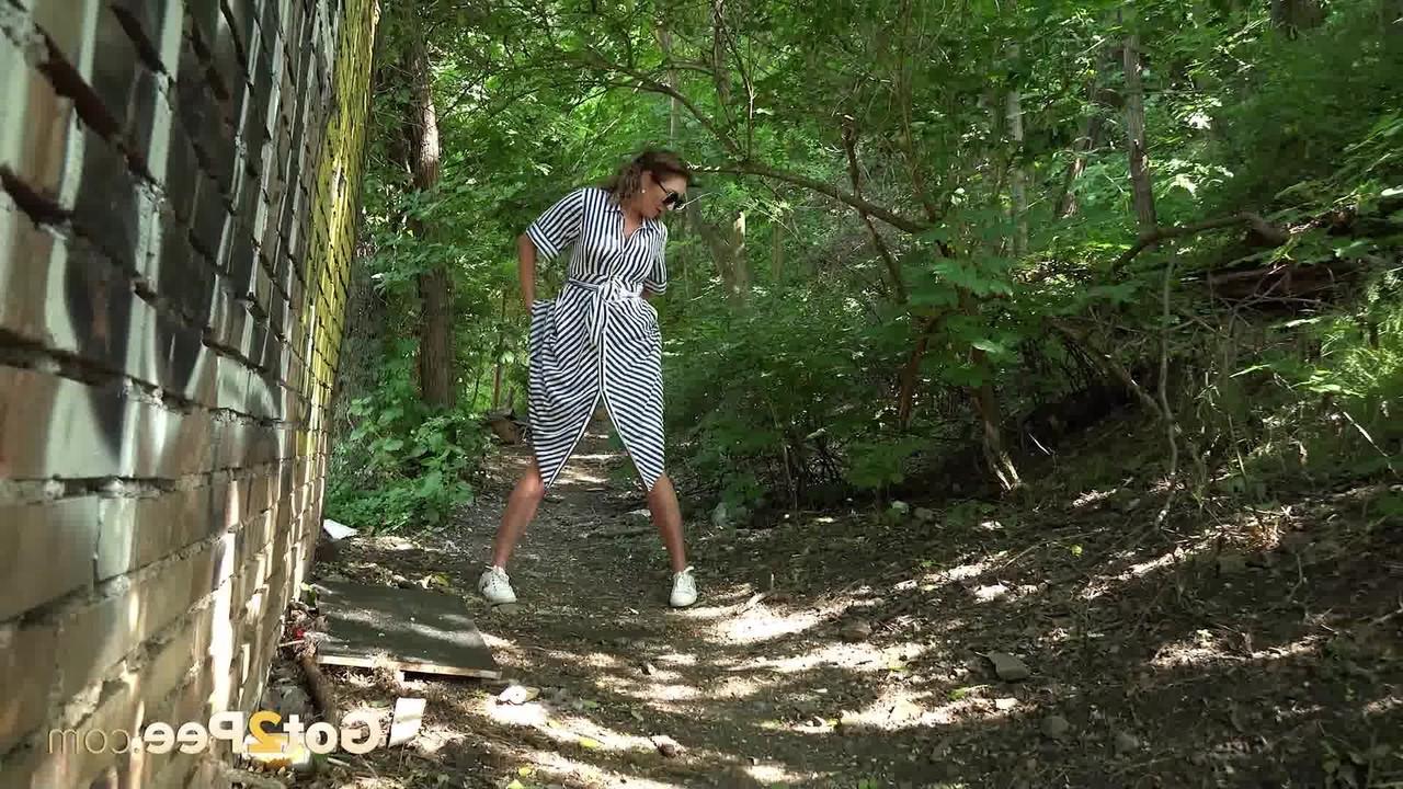 15P Caucasian chick Julia North gets caught taking a piss on a path in the woods
