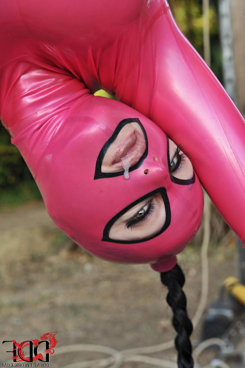 20P Brunette Latex Lucy gets face fucked while hanging from the tree