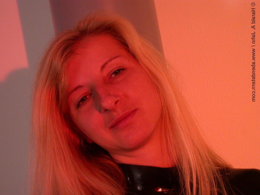 16P Natural blonde finds herself restrained to a glass table in latex clothing