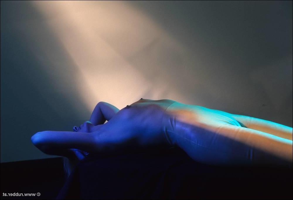 16P Natural blonde finds herself restrained to a glass table in latex clothing