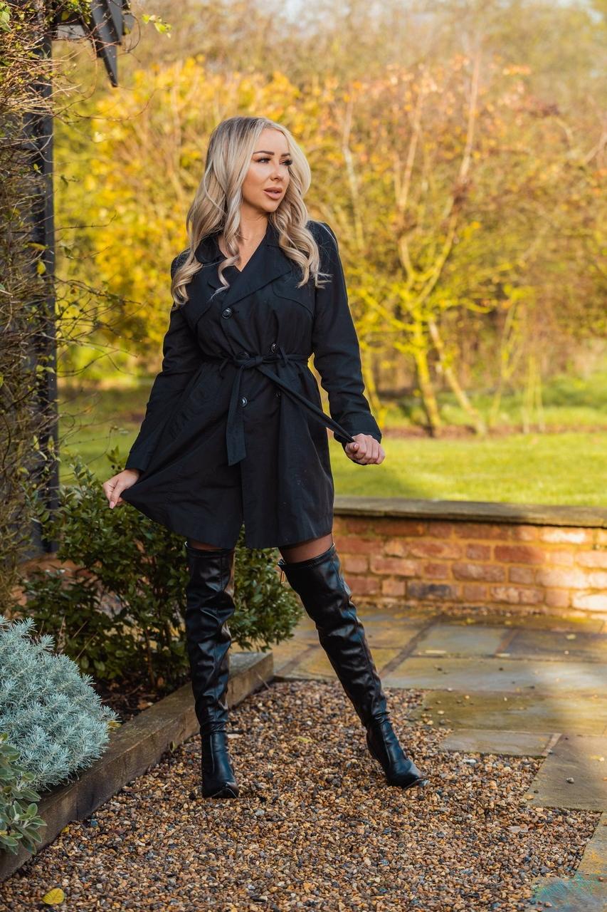 12P Hot blonde Beth Morgan removes an overcoat in a garter belt and nylons