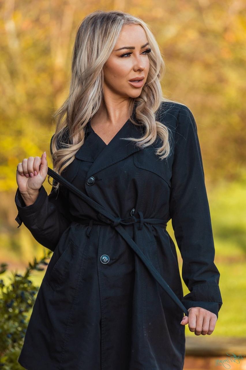 12P Hot blonde Beth Morgan removes an overcoat in a garter belt and nylons