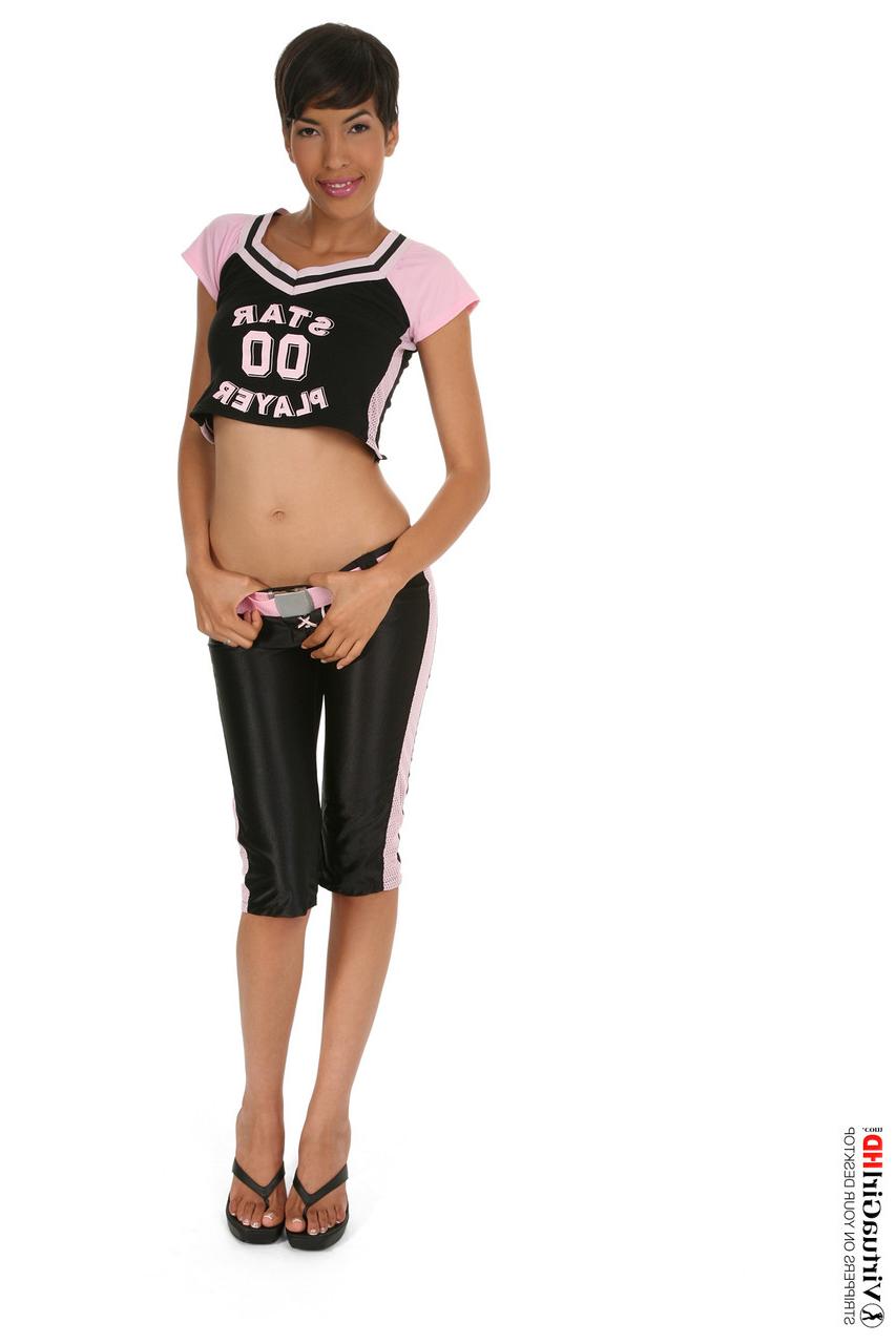15P Short haired female Jasmine Arabia holds a basketball while getting naked