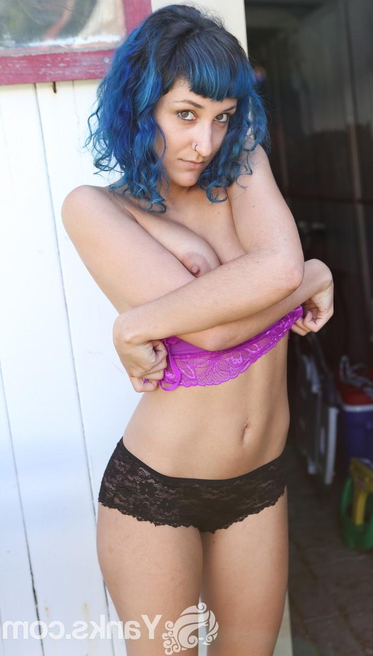 17P Blue haired vixen Jay Elle flaunts her hairy armpits and pussy while stripping