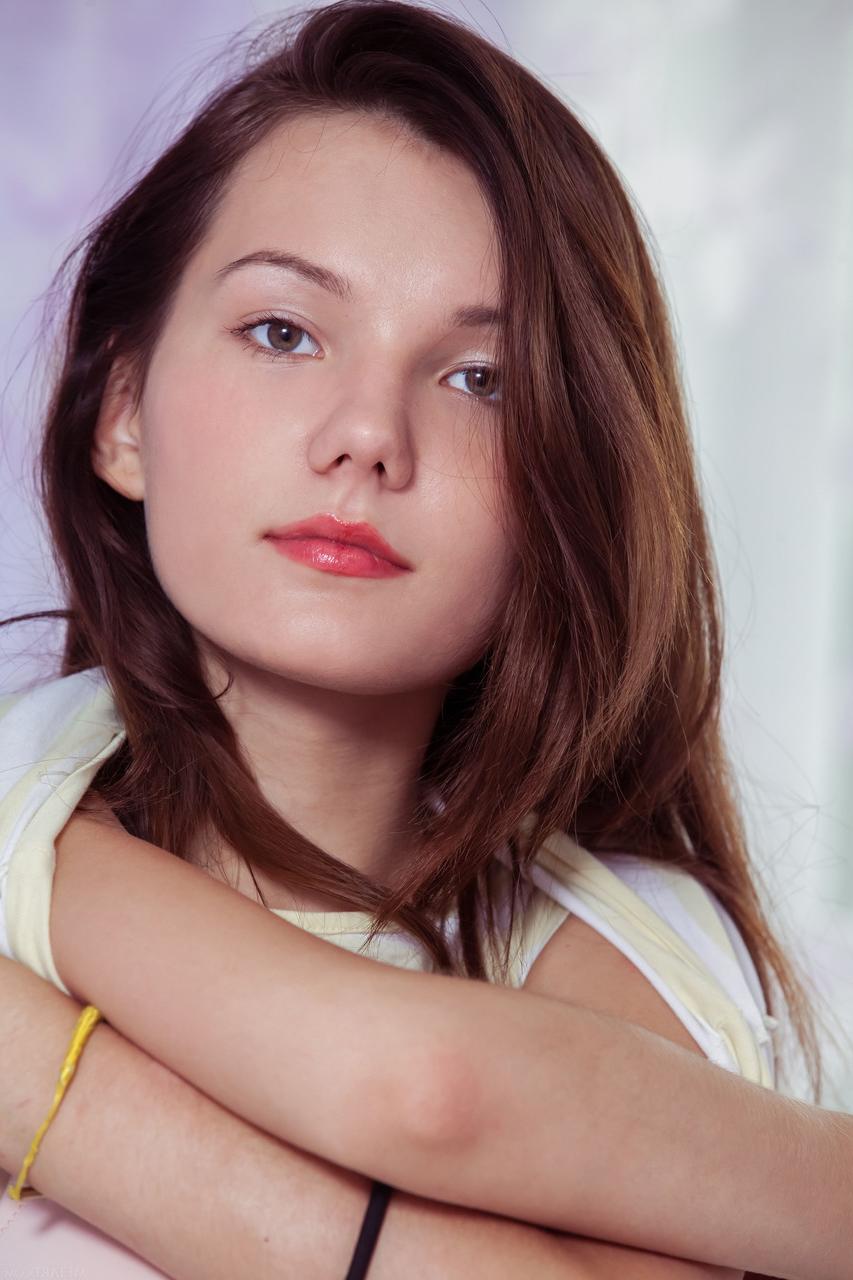 20P Pretty teen Iva stripping and exposing her hairy crotch and her big clit