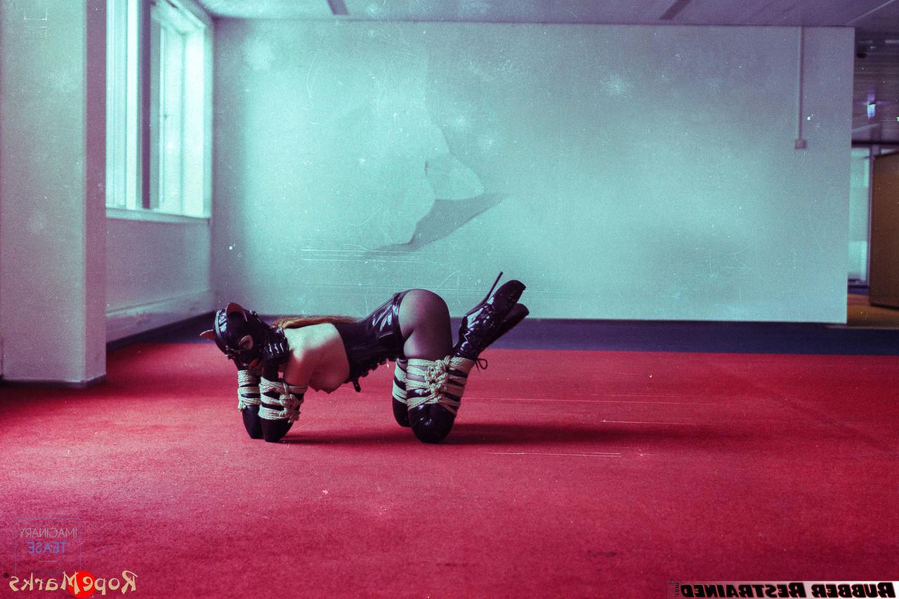 16P Redheaded girl Amarantha Lablanche is restrained with ropes in a latex outfit