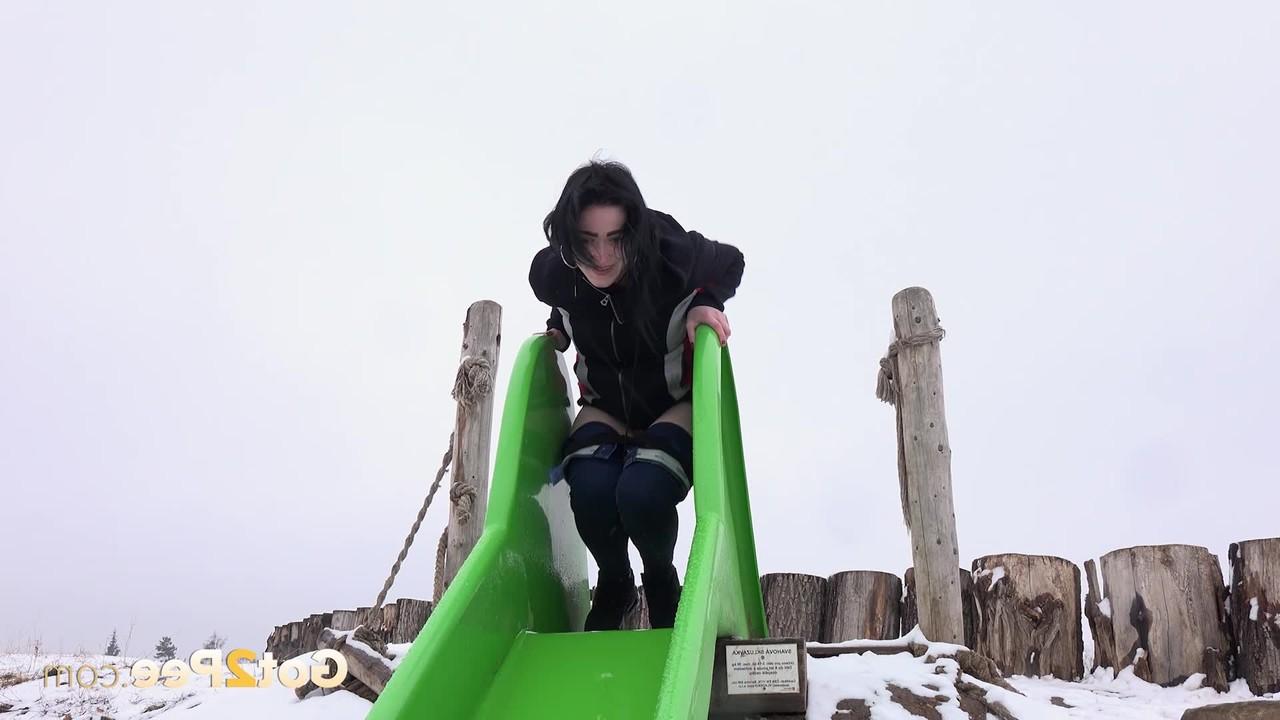 15P Dark-haired girl Selena takes a piss on a slide during the winter