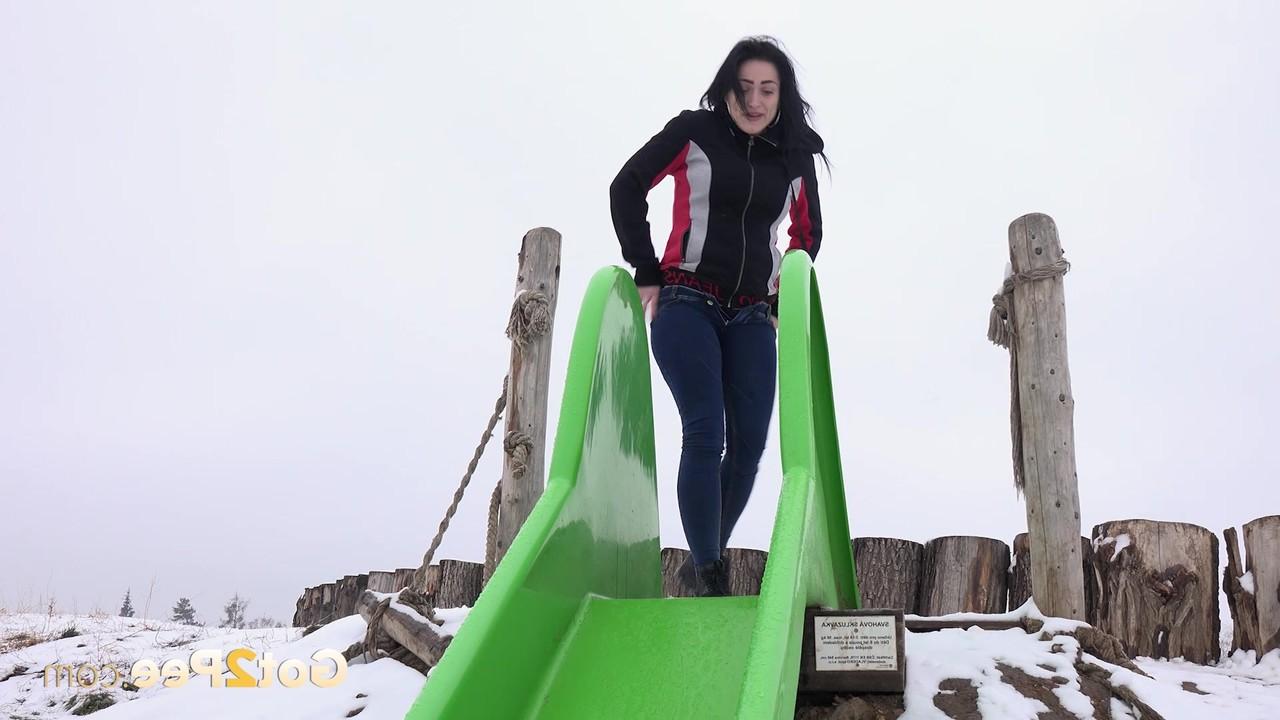15P Dark-haired girl Selena takes a piss on a slide during the winter