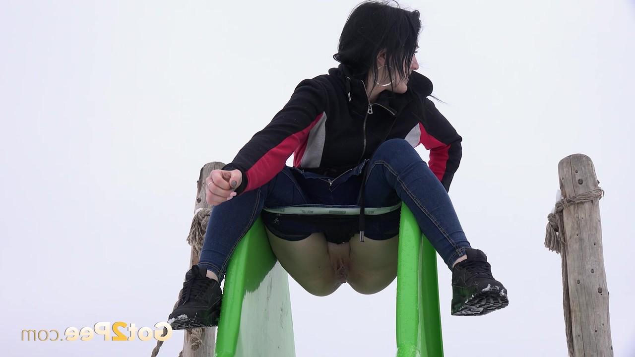15P Dark-haired girl Selena takes a piss on a slide during the winter