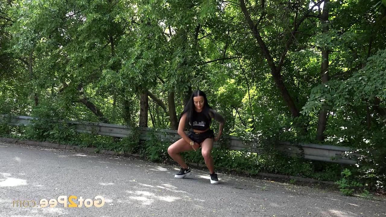 15P Dark-haired beauty Maddi Black gets caught taking a piss on paved ground