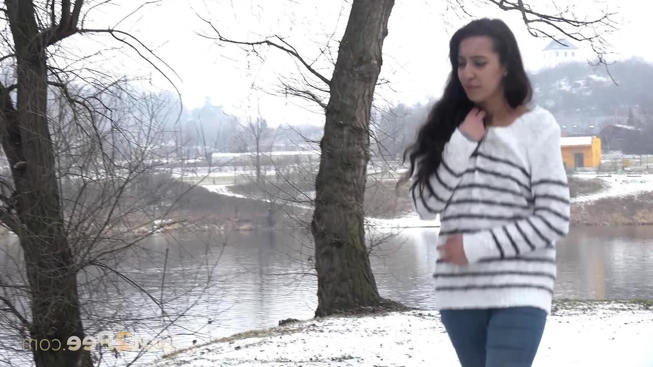15P Brunette chick Esperansa pees against a tree upon snow-covered ground