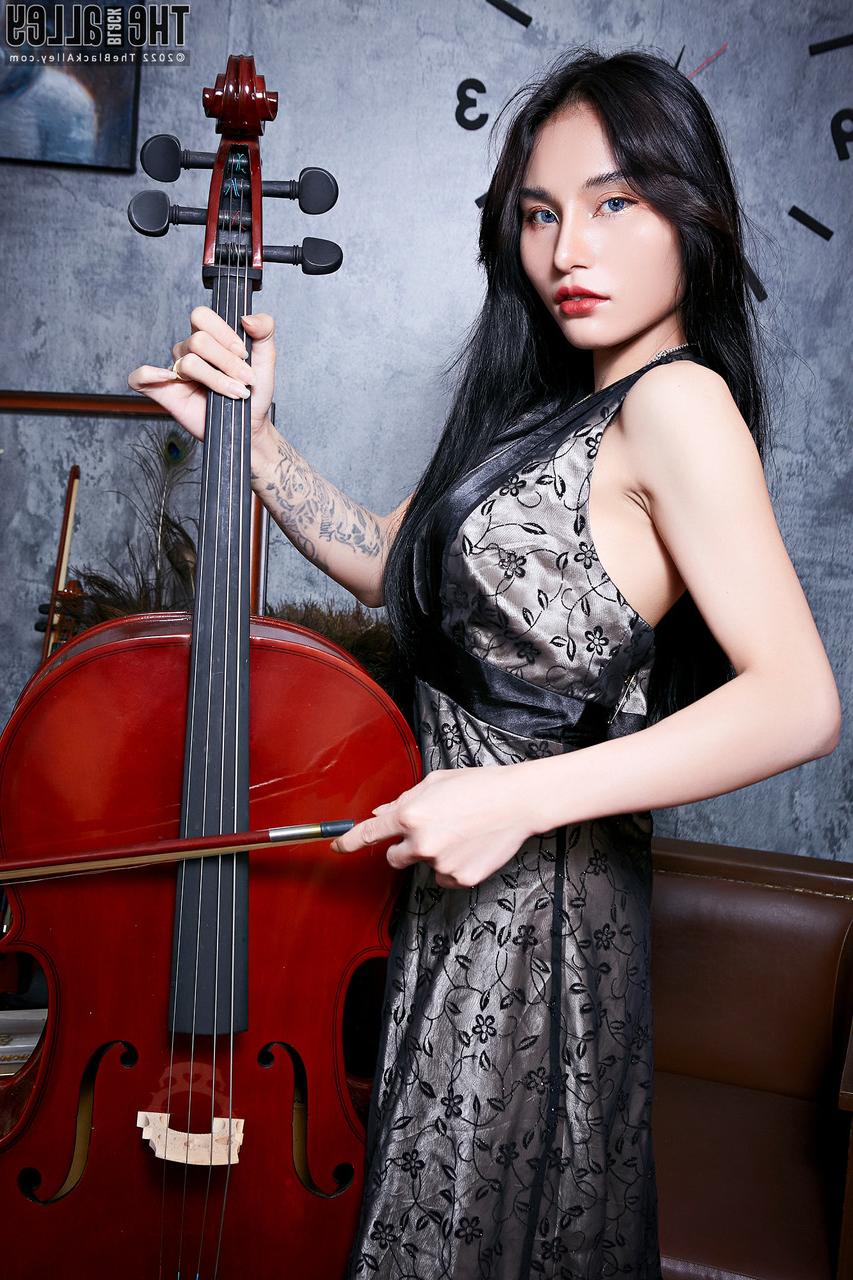 16P Asian cello player Kwan frees her firm tits before spreading her vagina