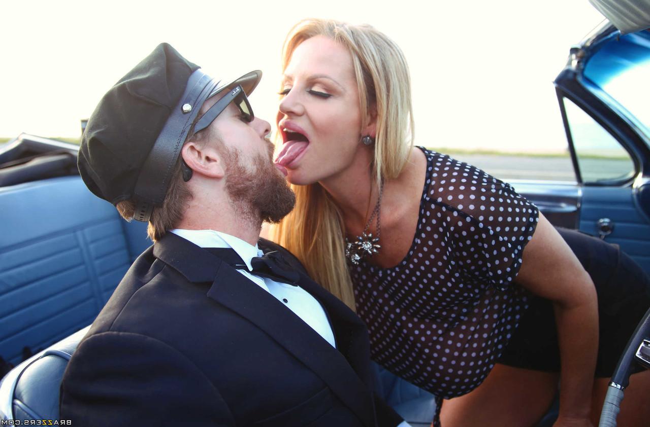 18P MILF Kelly Madison exposes her big tits & kisses her driver on the highway