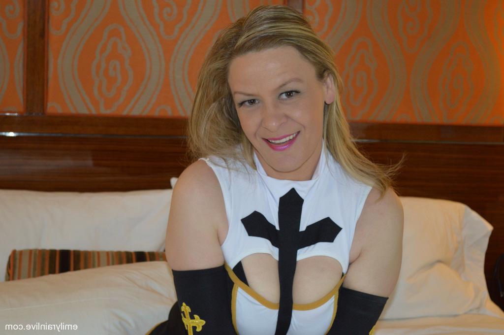 15P Naughty mature nun Emily Rain teases in her slutty uniform on her bed