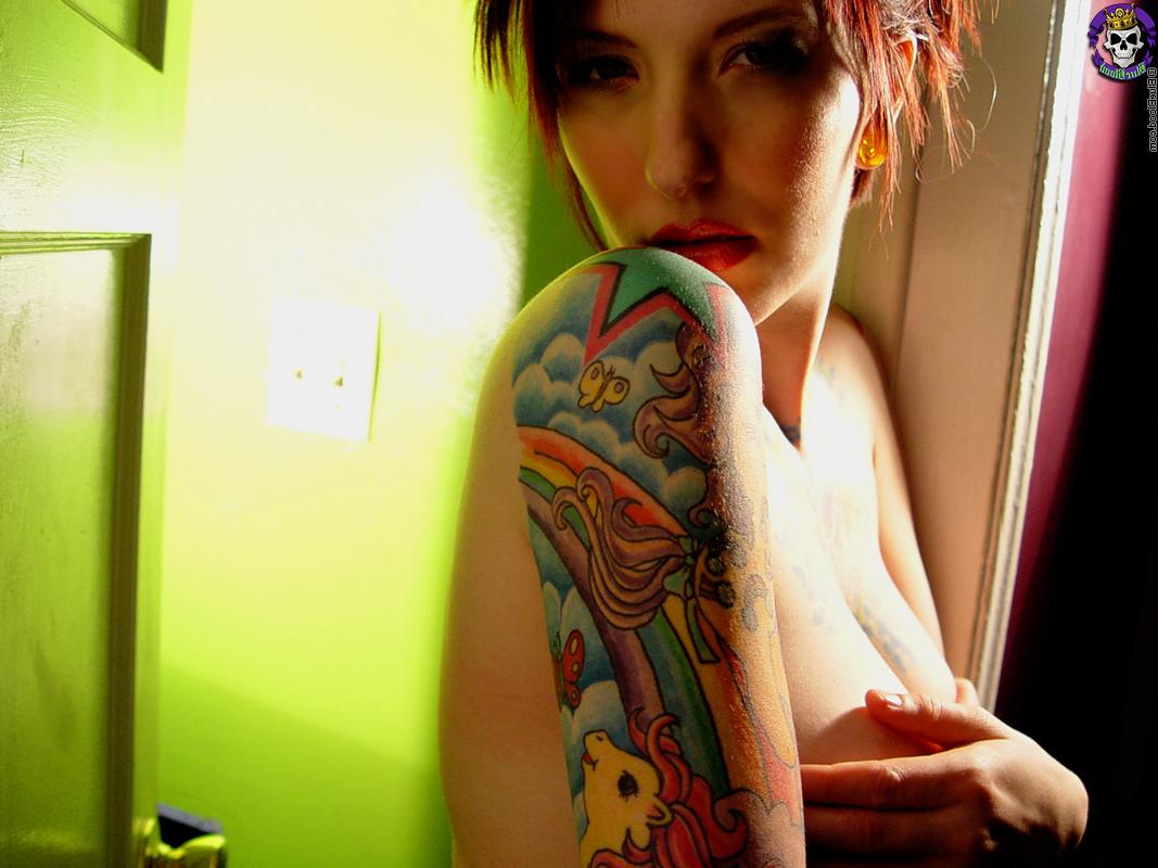 16P Tattooed redhead Erica uncovers her great tits during solo action