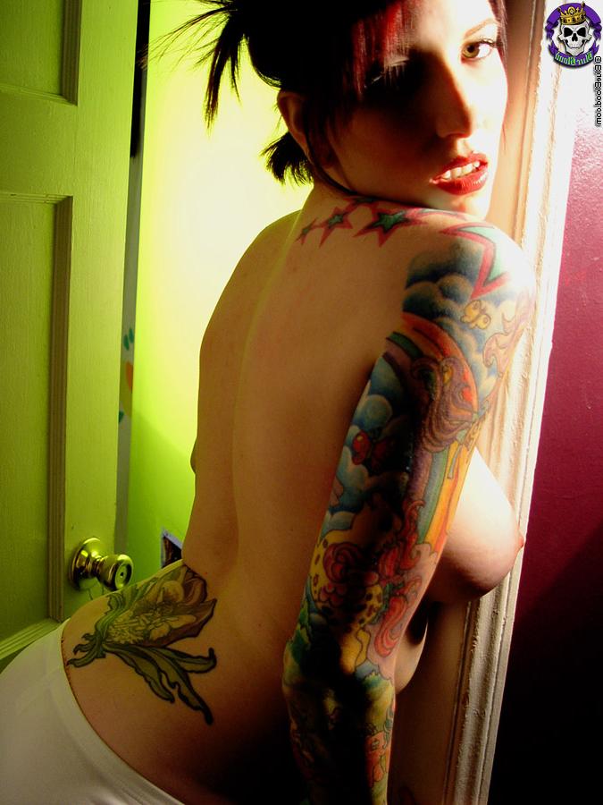16P Tattooed redhead Erica uncovers her great tits during solo action