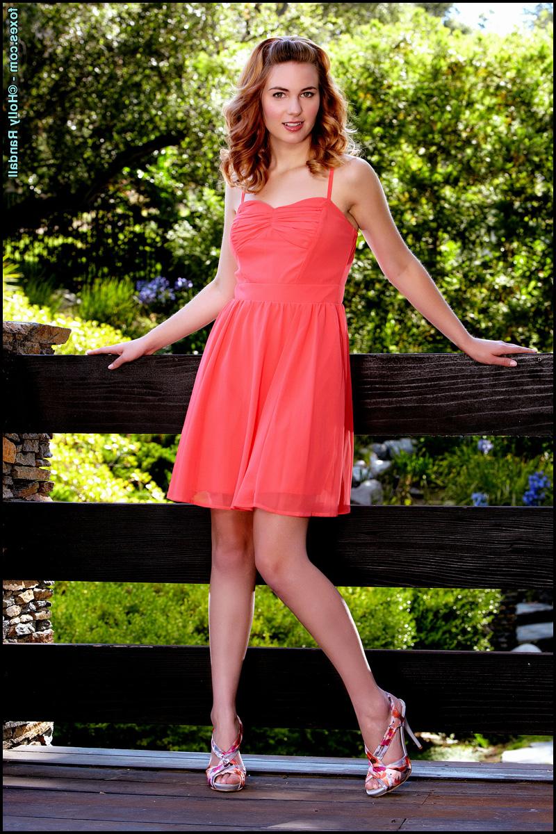 15P Pretty redhead Jonni Hennessy sets her great body free of a pretty dress