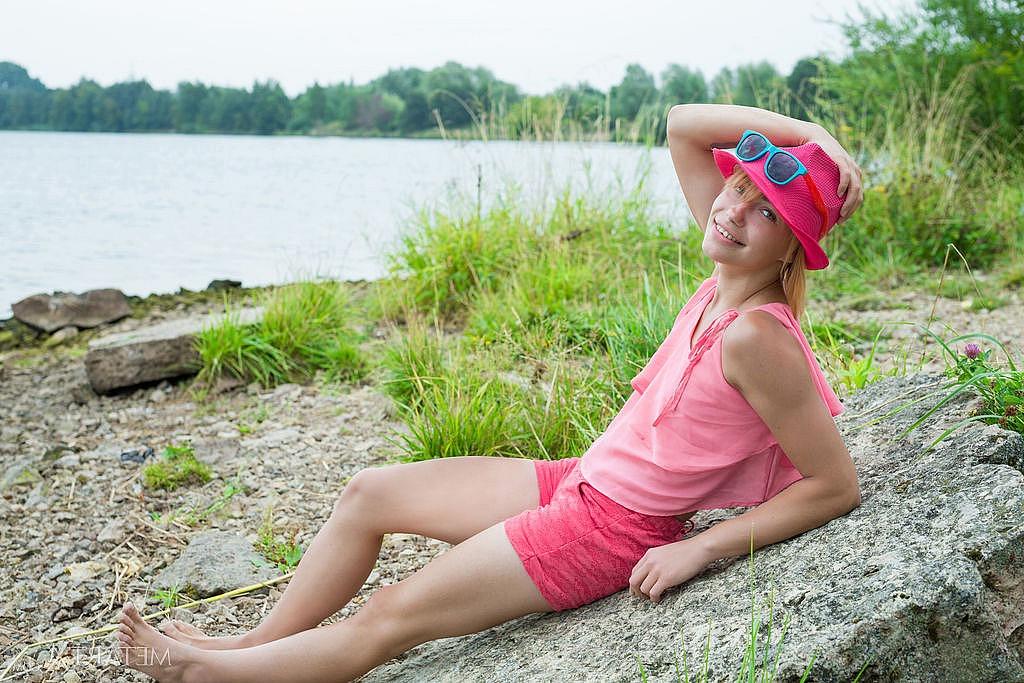 15P Petite redhead Shannan parts her pink teen pussy on a rocky shoreline