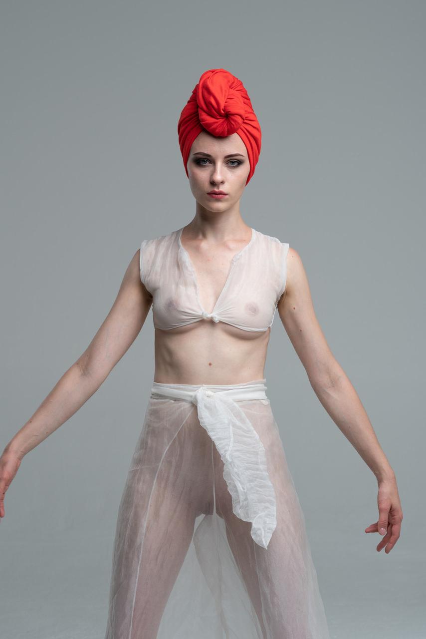 20P Beautiful babe does a sensual dance while wearing a see-through outfit
