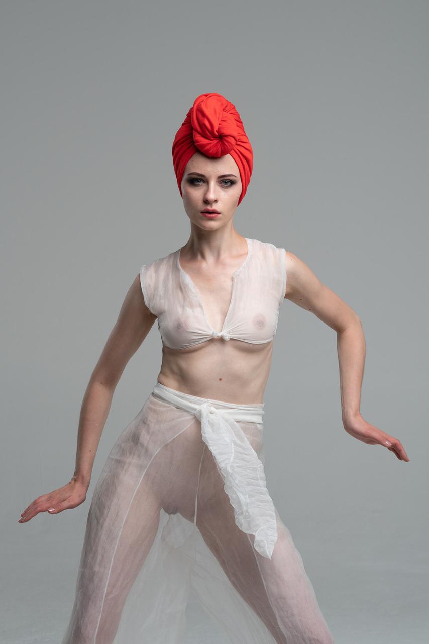 20P Beautiful babe does a sensual dance while wearing a see-through outfit