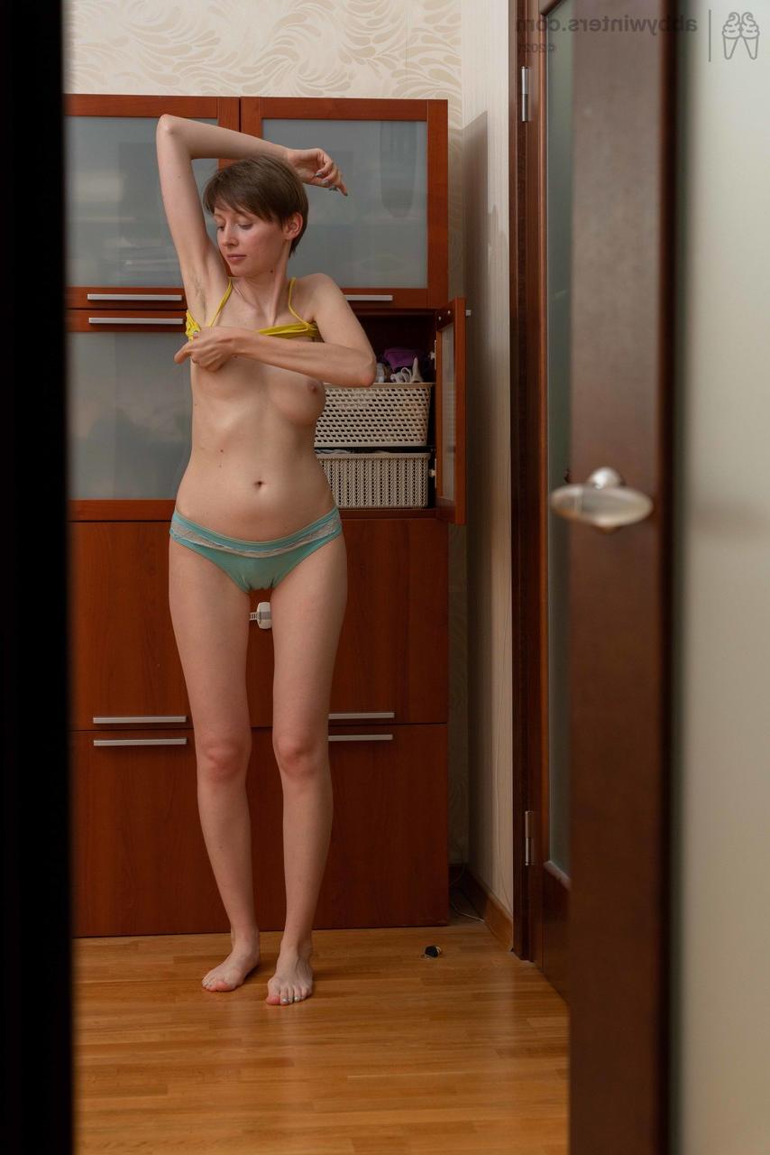 20P Sweet short haired amateur Erina gets spied on while dressing in a solo