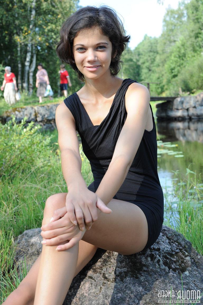 20P Pretty dark haired Tina removes her black dress by the pond to show tiny tits