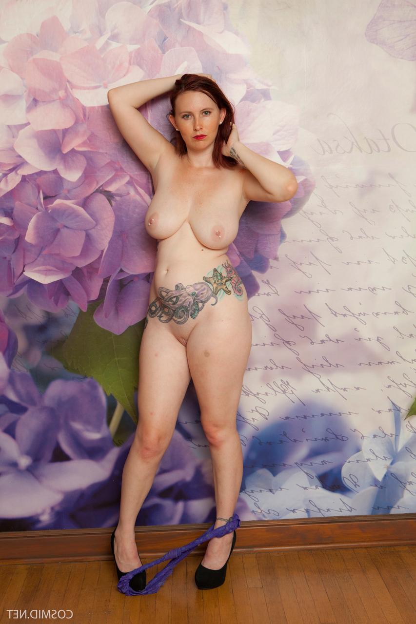 16P Natural redhead Mary Helen uncovers her big tits and tattoos as she disrobes