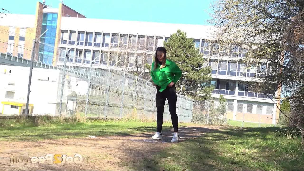 14P Pretty girl Naomi Benet takes a badly needed pee on a path near a fence