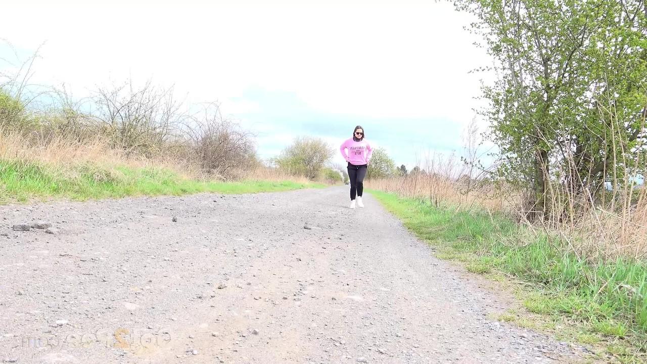 15P Solo girl Barbara Bieber pulls down her leggings to pee on a country road