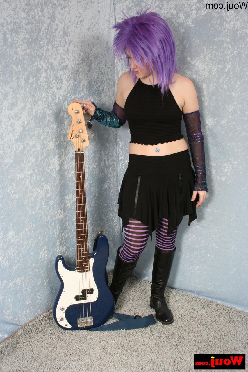 15P Purple-haired guitarist posing in her sexy black outfit in a solo