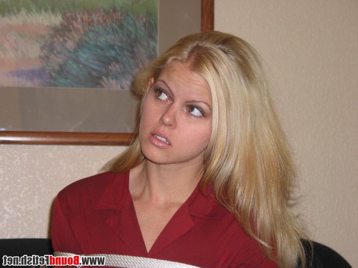 16P Blonde girl is gagged and tied up on a sofa while fully clothed