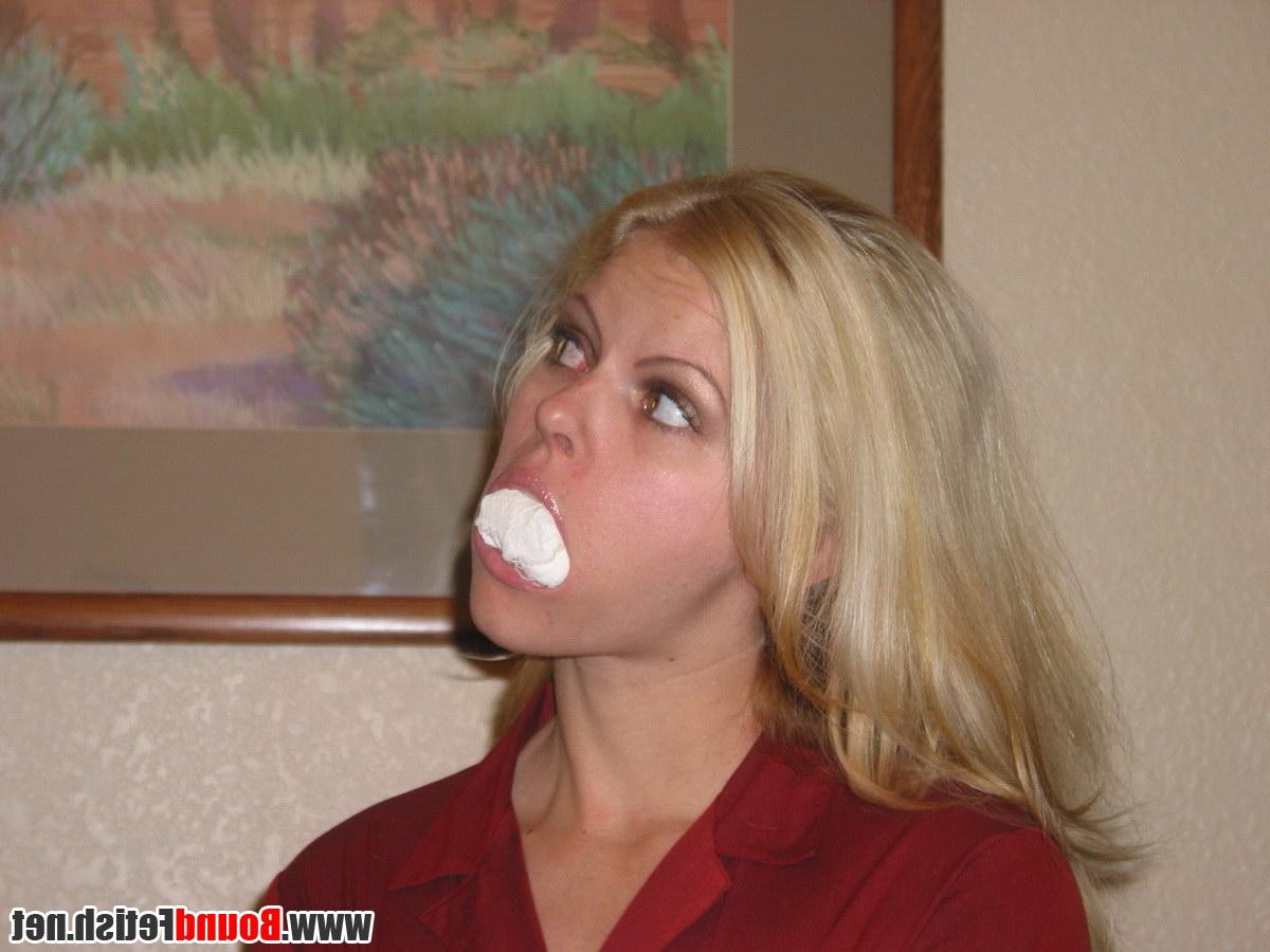 16P Blonde girl is gagged and tied up on a sofa while fully clothed