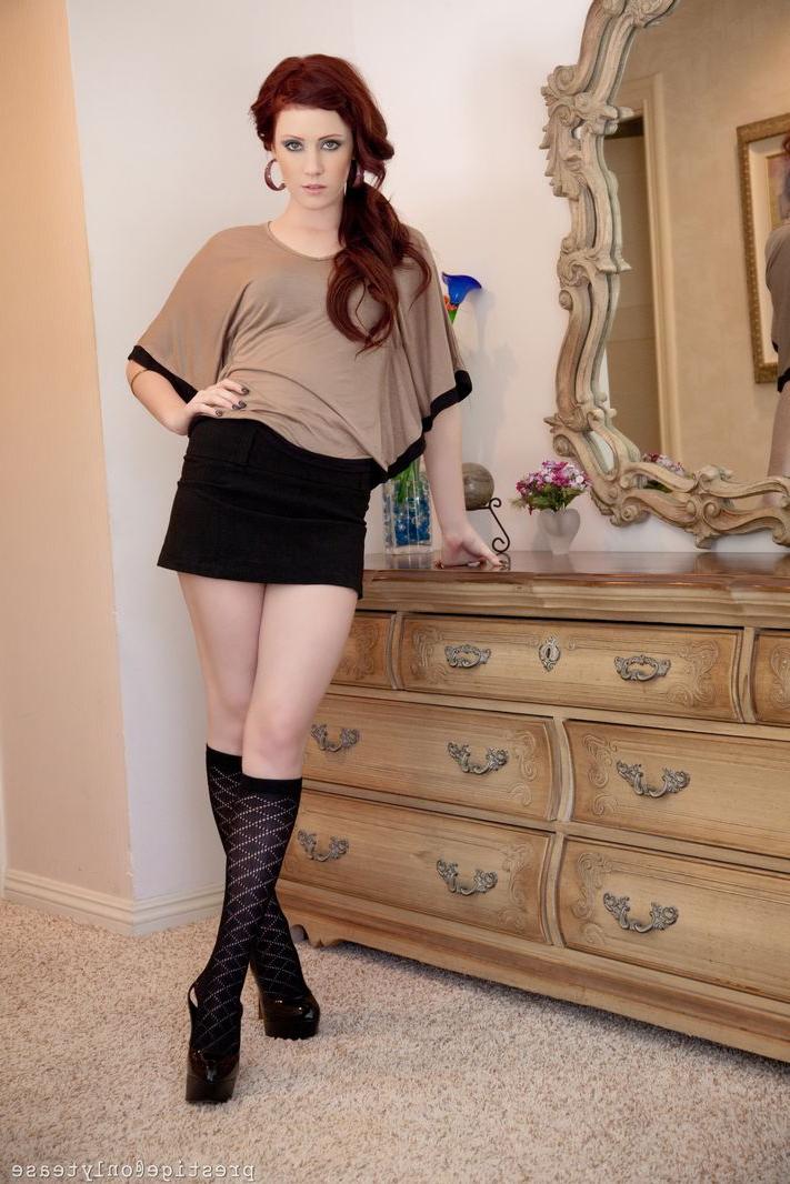 16P Pale redhead Elle Alexandra strips to knee sock and a thong afore a mirror