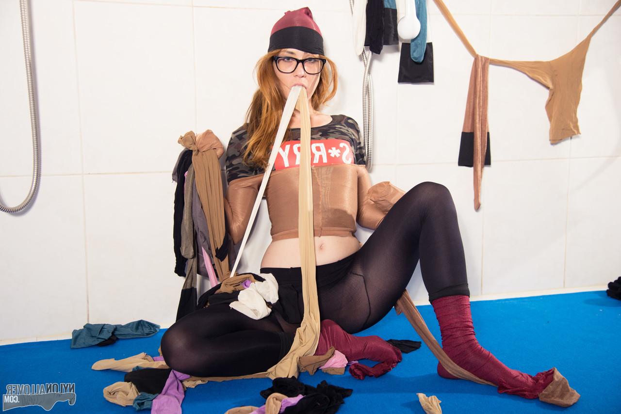 16P Sexy redhead Foxy Sanie adorns herself in multiple layers of hose and nylons