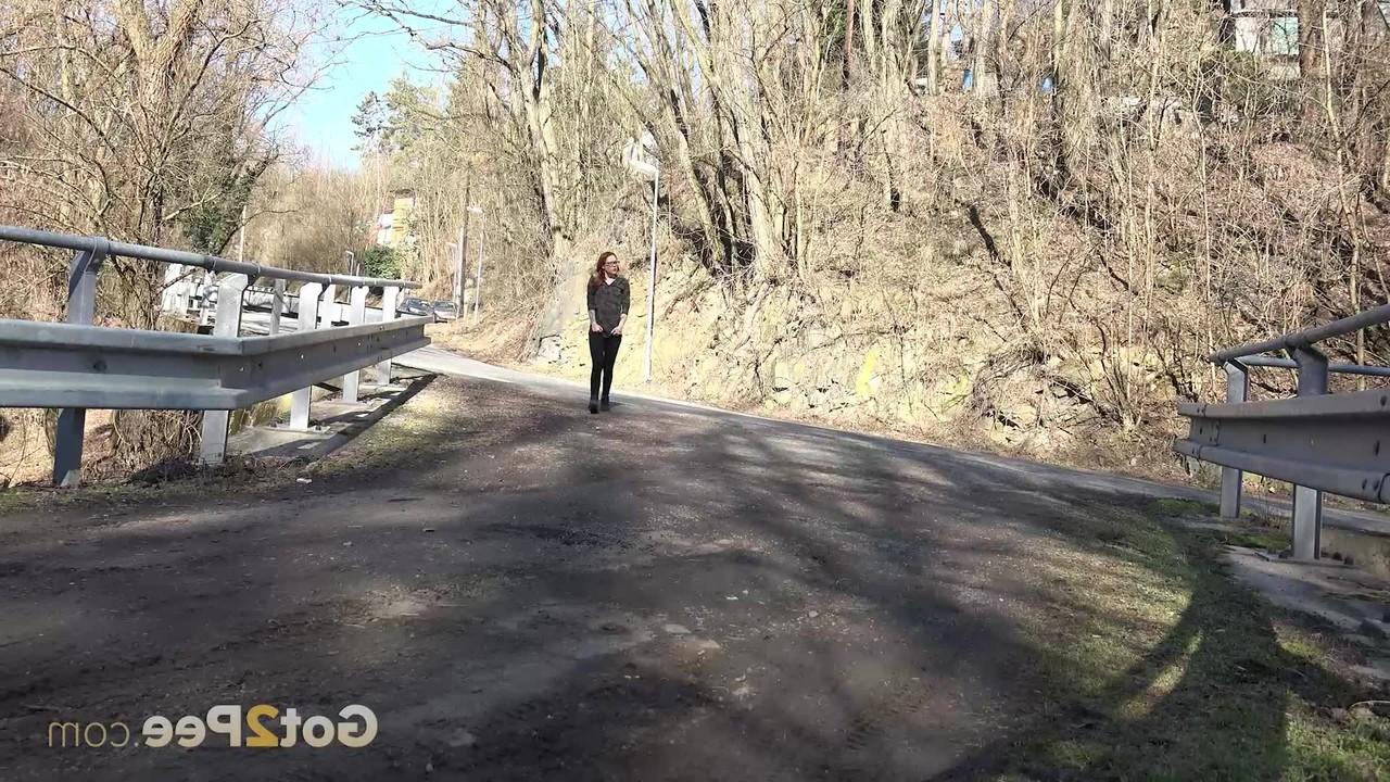 15P Pretty girl Sandra gets caught with their pants down while peeing on a road