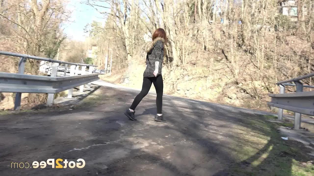 15P Pretty girl Sandra gets caught with their pants down while peeing on a road