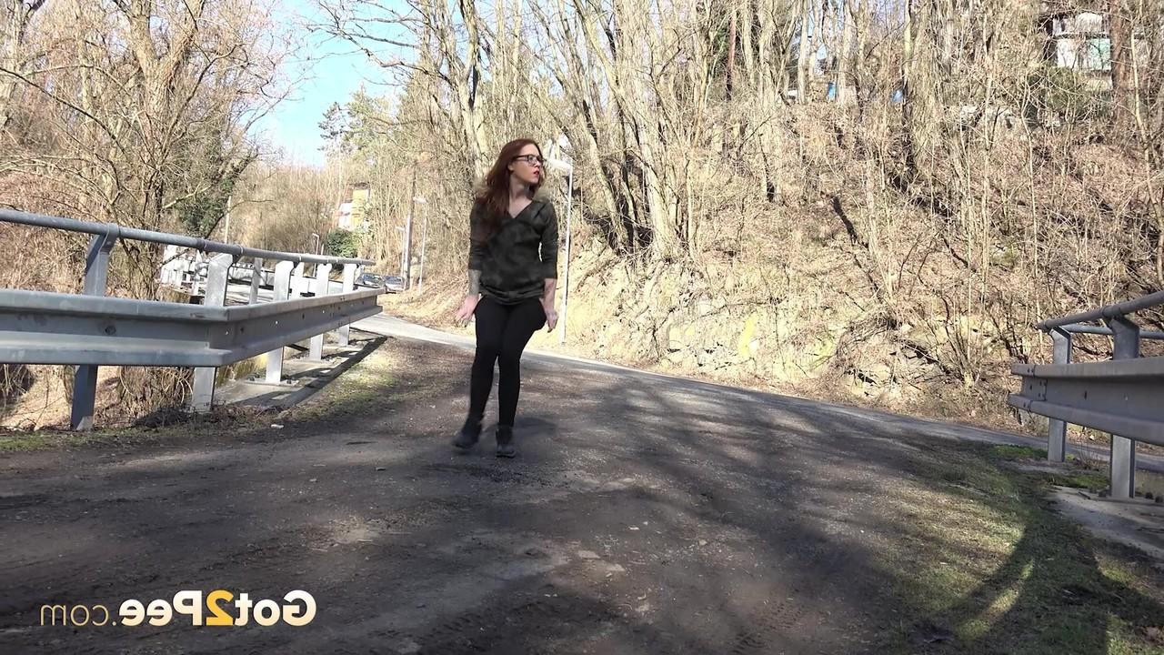 15P Pretty girl Sandra gets caught with their pants down while peeing on a road