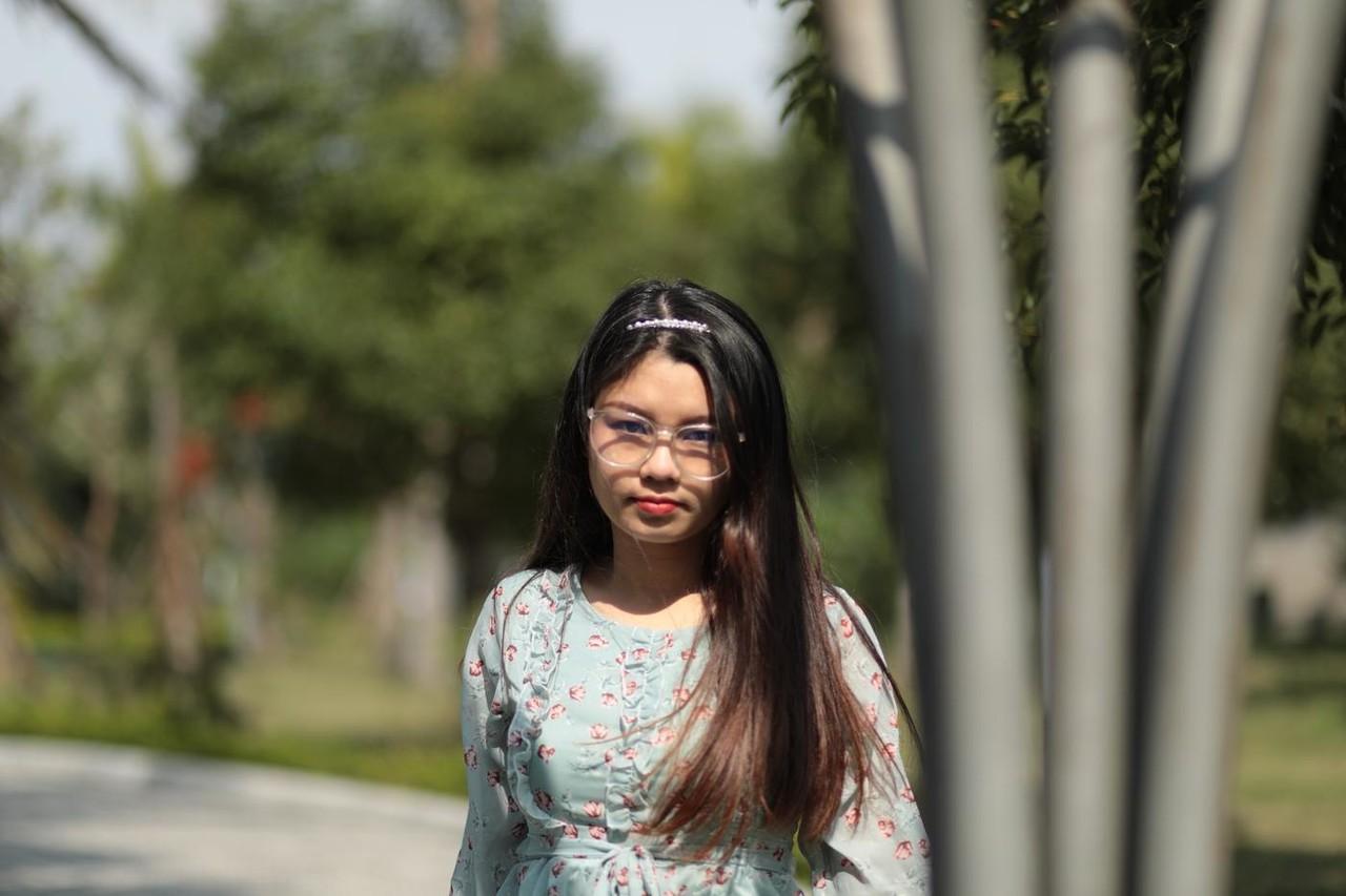 20P Dark-haired Asian babe Natalia posing in her summer dress in public