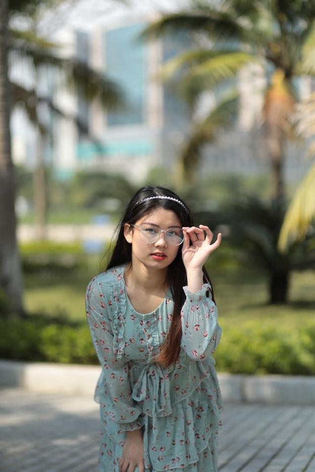 20P Dark-haired Asian babe Natalia posing in her summer dress in public
