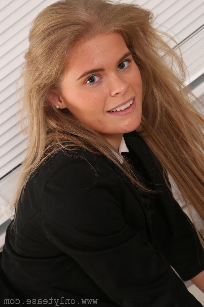20P Cute secretary Tayla posing on the office desk in black stockings and panties